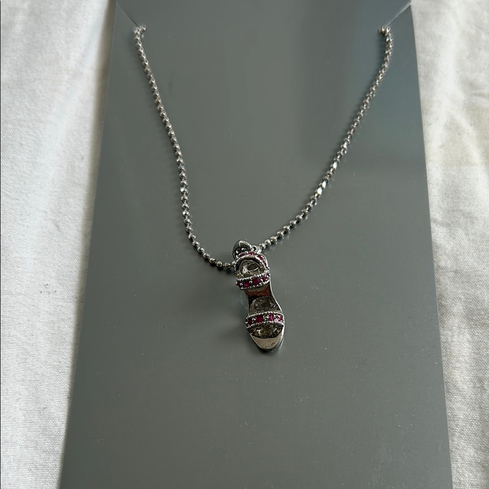 Silver Necklace with Red Sandal Pendant.
Vintage sandal. Brand new